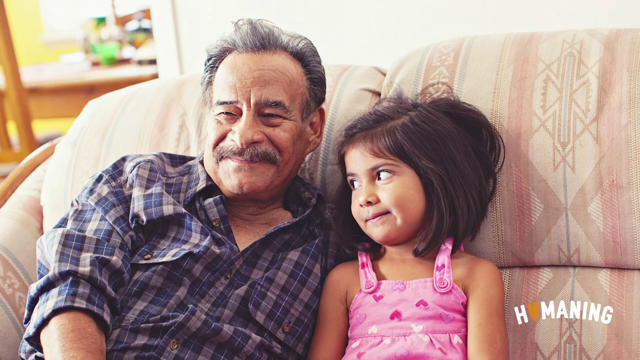 older man and young girl sitting together