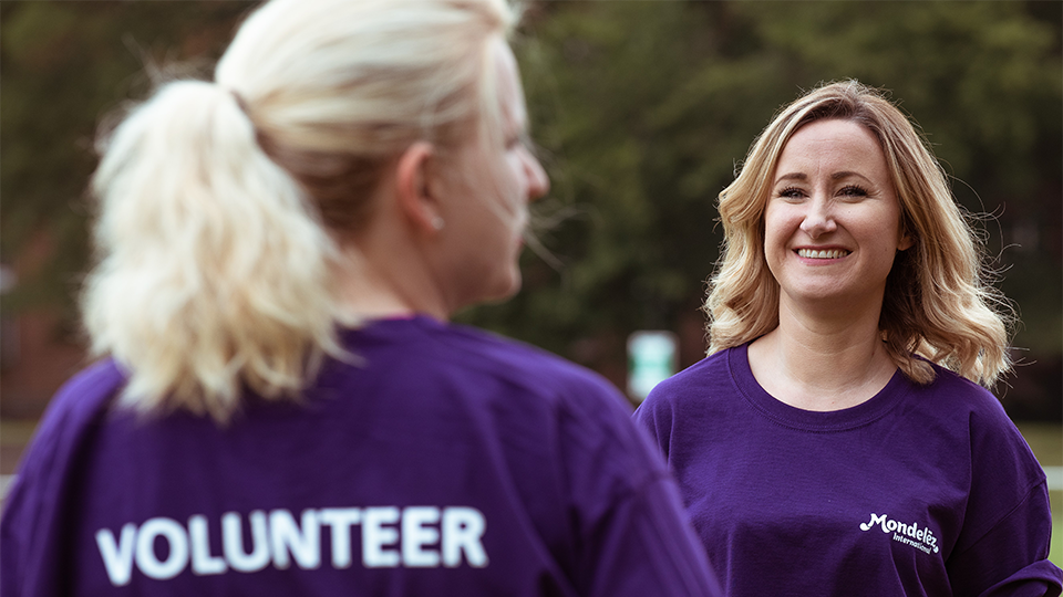 Two employees volunteering