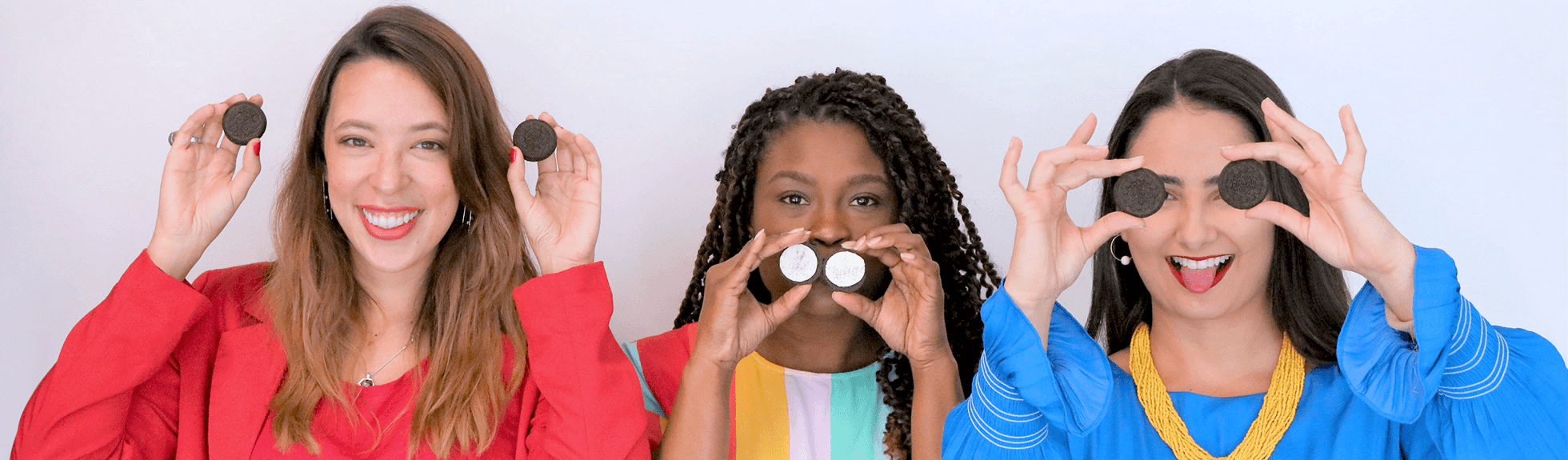 Three Mondelez employees with Oreo cookies