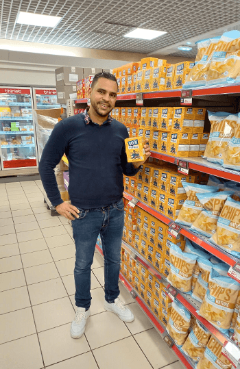 Person in store with Mondelez product