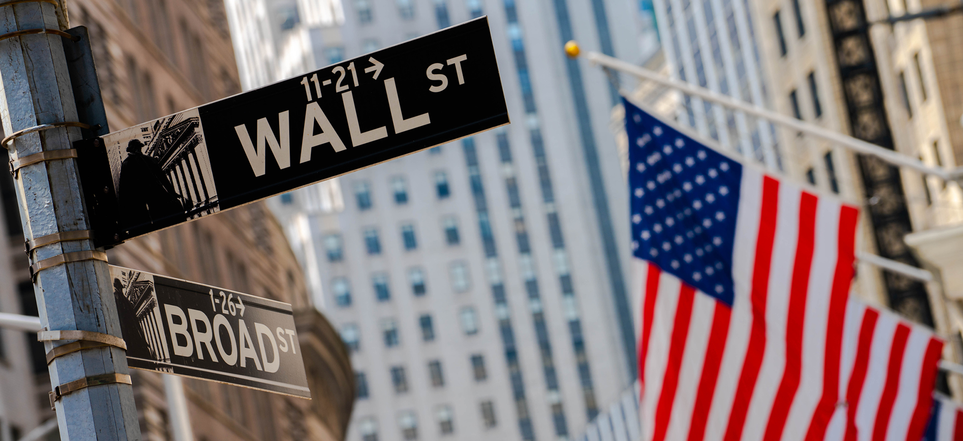 Wall Street sign and American Flag