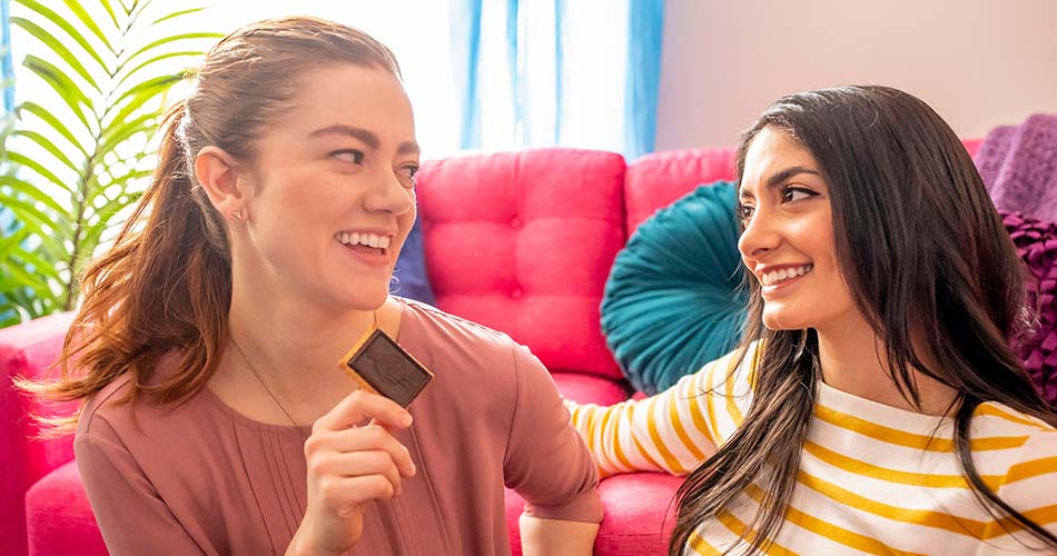 Two women enjoying a snack